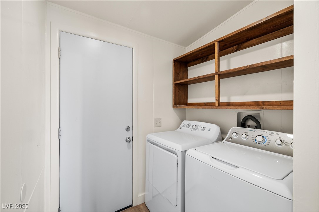 1771 East Brian Road Pahrump, NV 89048 - Photo 18 of 29 Washroom with washing machine and clothes dryer and ornamental molding