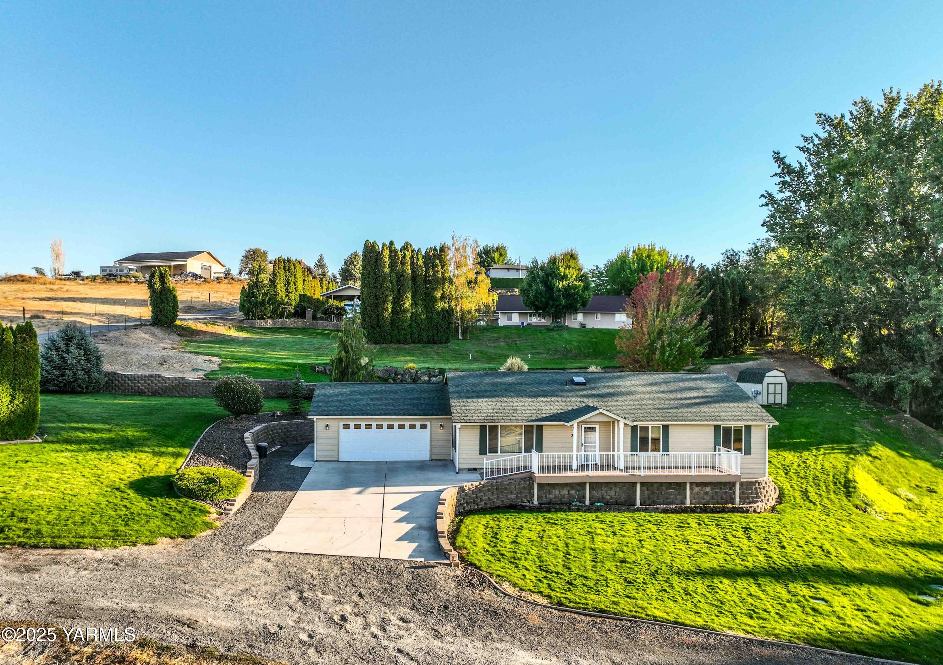 320 Westridge Road Selah, WA 98942 - Photo 3 of 53 an aerial view of a house with a yard table and chairs