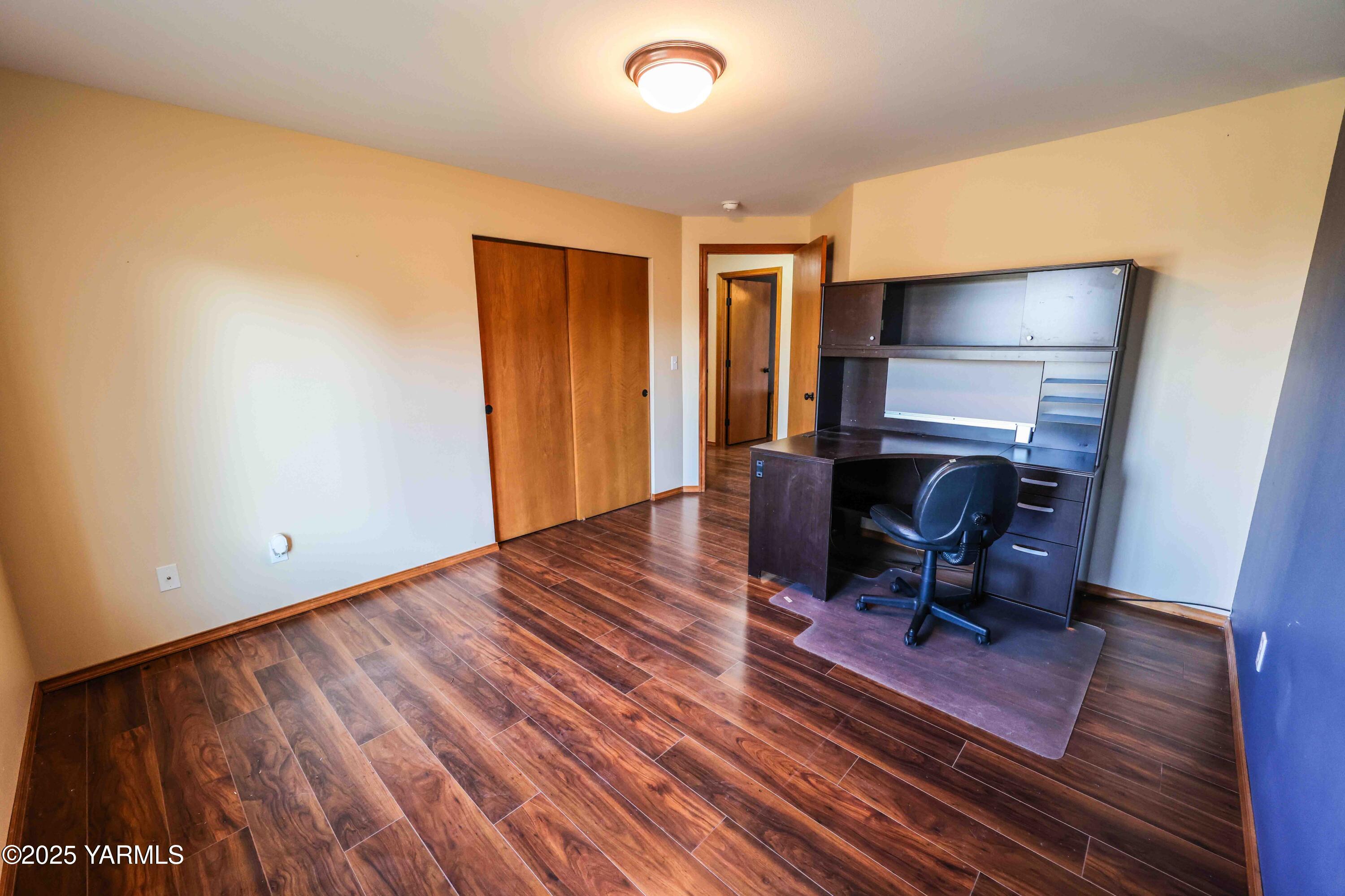 320 Westridge Road Selah, WA 98942 - Photo 41 of 53 a view of a workspace with furniture and wooden floor