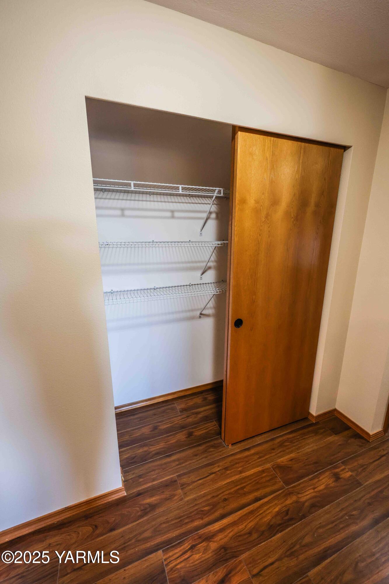 320 Westridge Road Selah, WA 98942 - Photo 48 of 53 a view of an empty room with wooden floor and a window