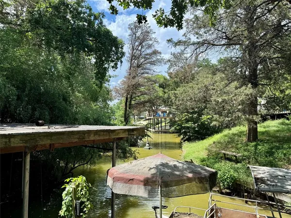a view of backyard with swimming pool and outdoor seating