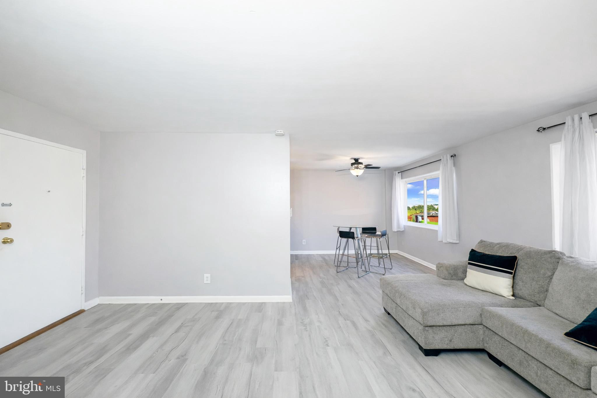 614 Sligo Avenue, Unit 405 Silver Spring, MD 20910 - Photo 14 of 29 a living room with furniture and a table