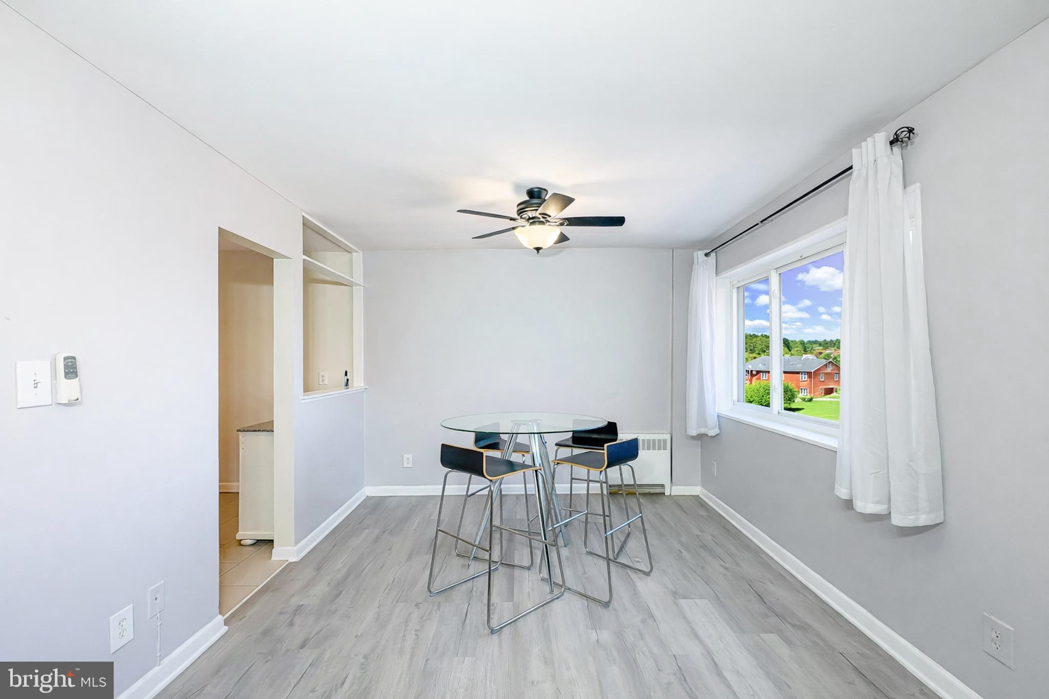 614 Sligo Avenue, Unit 405 Silver Spring, MD 20910 - Photo 16 of 29 a view of a dining room with furniture window and wooden floor