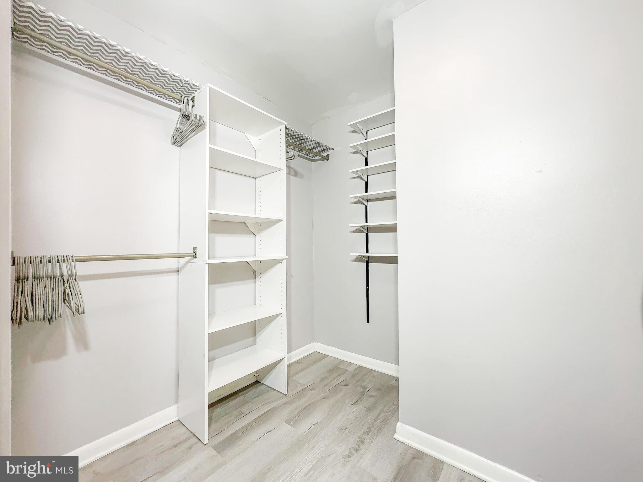 614 Sligo Avenue, Unit 405 Silver Spring, MD 20910 - Photo 18 of 29 a view of walk in closet with empty racks