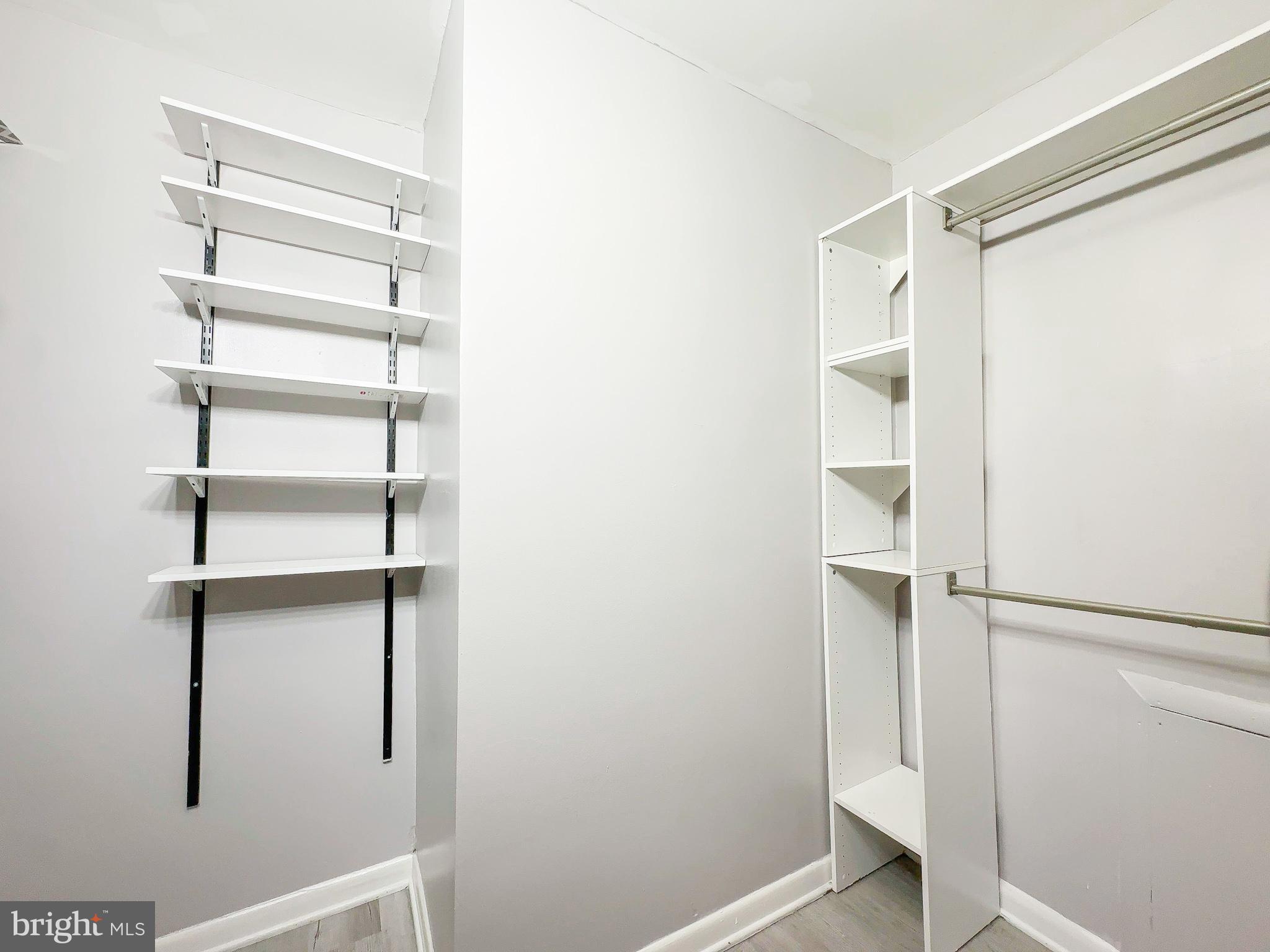 614 Sligo Avenue, Unit 405 Silver Spring, MD 20910 - Photo 20 of 29 a view of walk in closet with empty racks