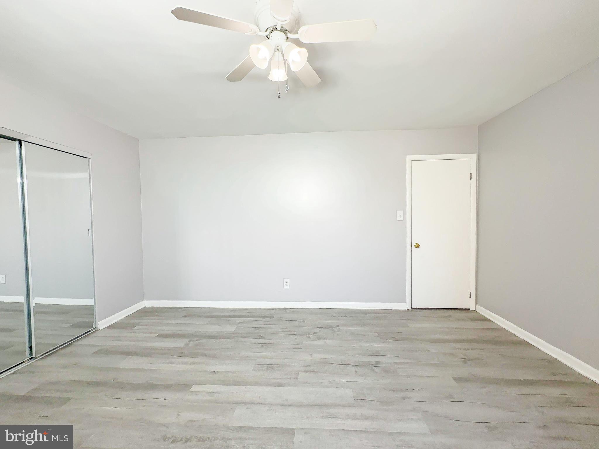 614 Sligo Avenue, Unit 405 Silver Spring, MD 20910 - Photo 22 of 29 a view of an empty room with wooden floor