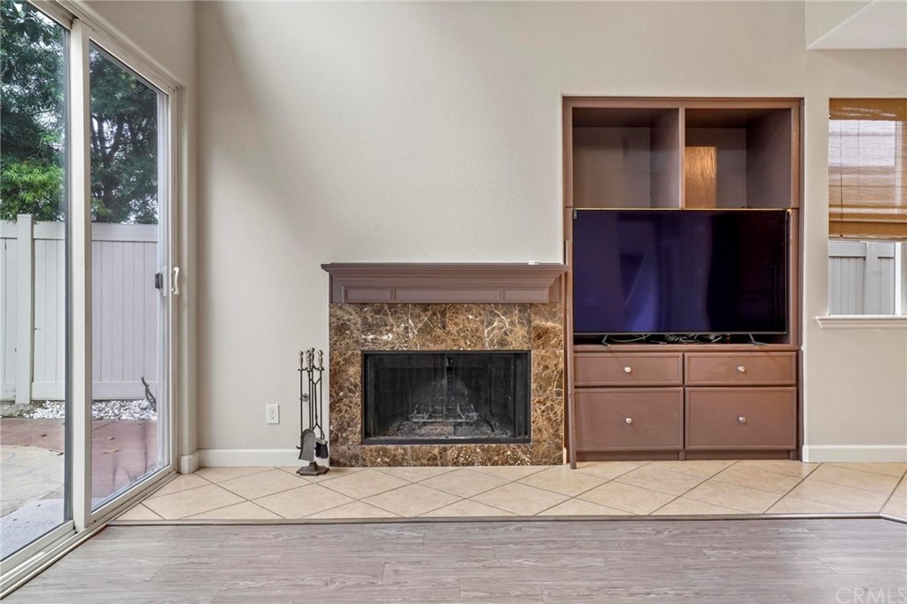 569 Inverlochy Drive Fallbrook, CA 92028 - Photo 13 of 36 a living room with furniture and a fireplace