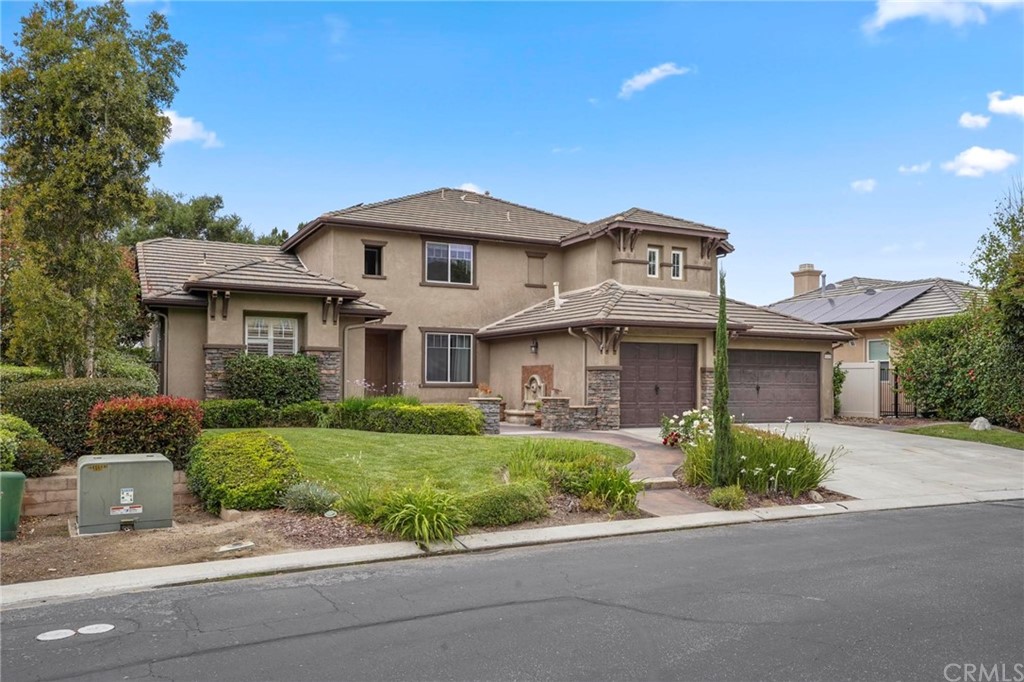 569 Inverlochy Drive Fallbrook, CA 92028 - Photo 2 of 36 a front view of a house with a garden