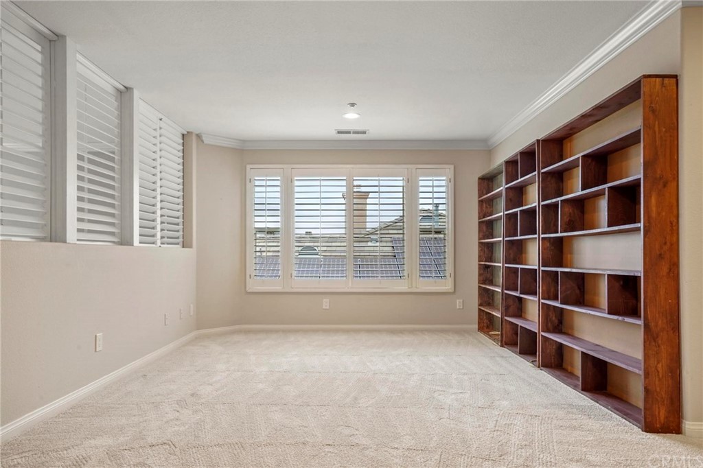 569 Inverlochy Drive Fallbrook, CA 92028 - Photo 23 of 36 a view of an empty room with a window and a room