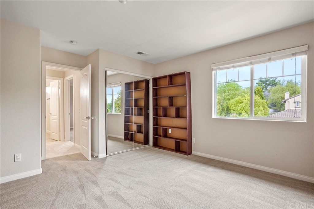 569 Inverlochy Drive Fallbrook, CA 92028 - Photo 33 of 36 an empty room with a window and closet
