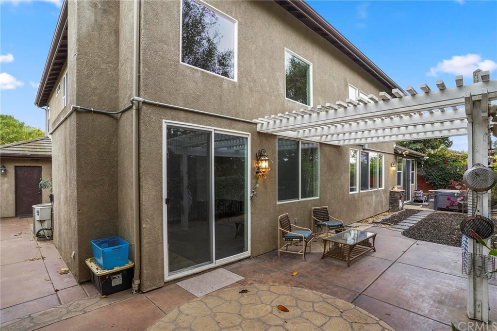 569 Inverlochy Drive Fallbrook, CA 92028 - Photo 35 of 36 a view of a patio with dining table and chairs