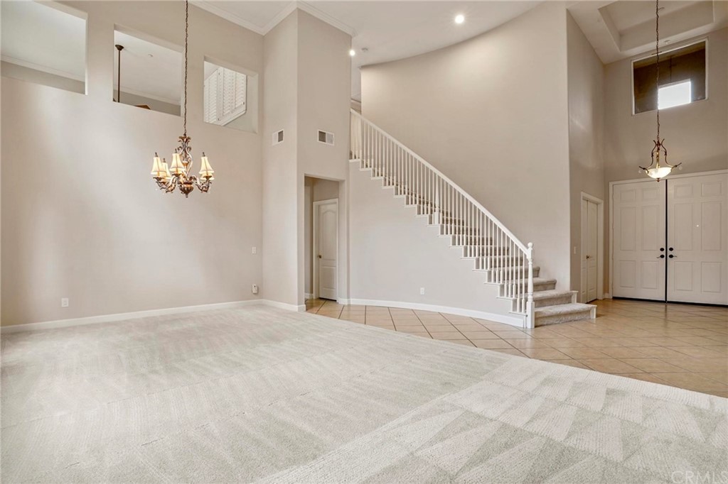 569 Inverlochy Drive Fallbrook, CA 92028 - Photo 4 of 36 a view of an empty room with stairs