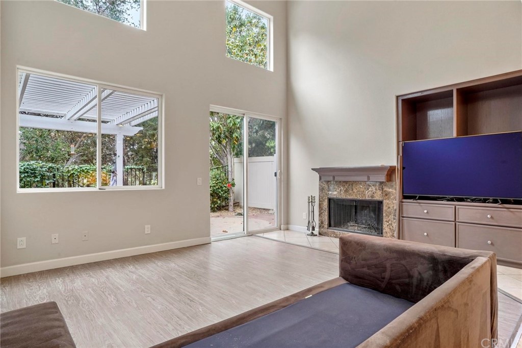 569 Inverlochy Drive Fallbrook, CA 92028 - Photo 9 of 36 a kitchen with furniture and a fireplace