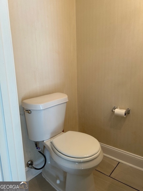 295 Handley Court Tyrone, GA 30290 - Photo 12 of 25 a white toilet sitting next to a white sink