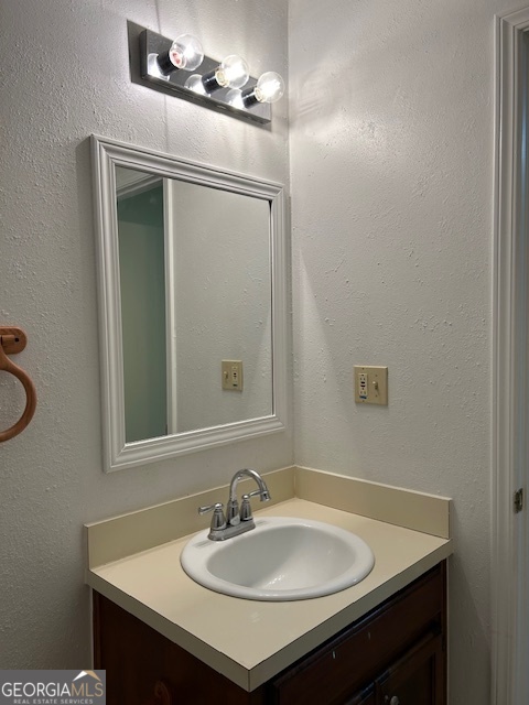 295 Handley Court Tyrone, GA 30290 - Photo 23 of 25 a bathroom with a sink and a mirror