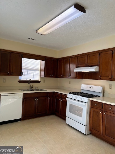 295 Handley Court Tyrone, GA 30290 - Photo 7 of 25 a kitchen with stainless steel appliances granite countertop a stove and a sink