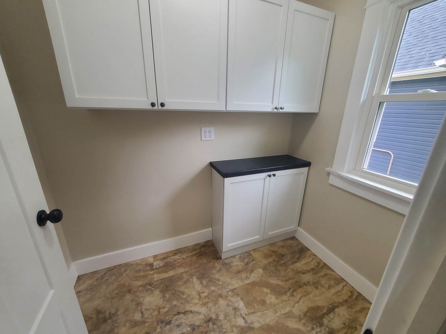 712 3rd Street Moline, IL 61265 - Photo 27 of 29 a view of storage and utility room with granite countertop