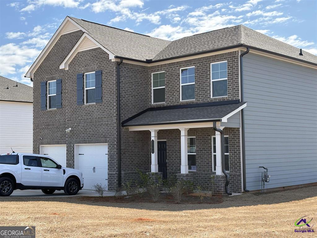 1100 Holland Drive Hampton, GA 30228 - Photo 1 of 15 a view of a house with a yard