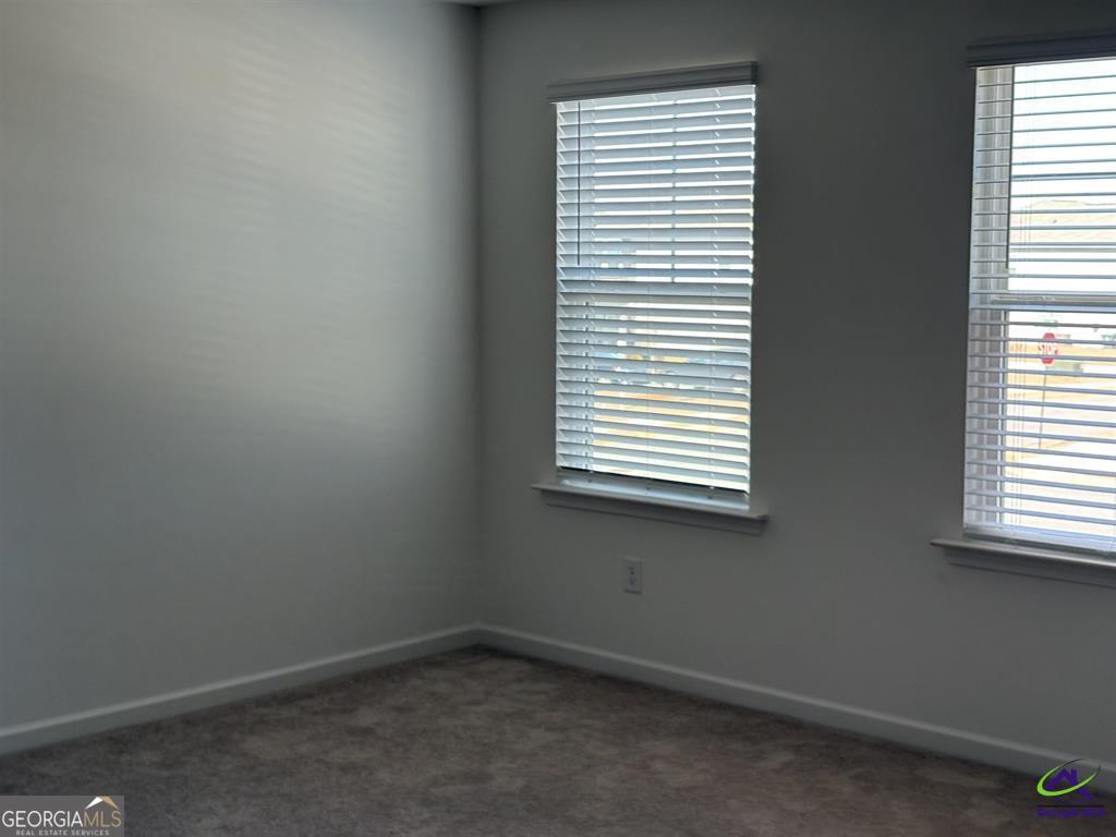 1100 Holland Drive Hampton, GA 30228 - Photo 14 of 15 an empty room with a window
