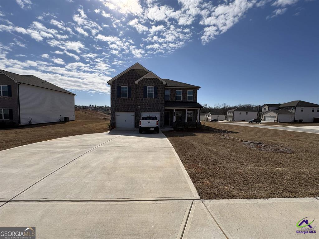 1100 Holland Drive Hampton, GA 30228 - Photo 15 of 15 a front view of a house with a yard
