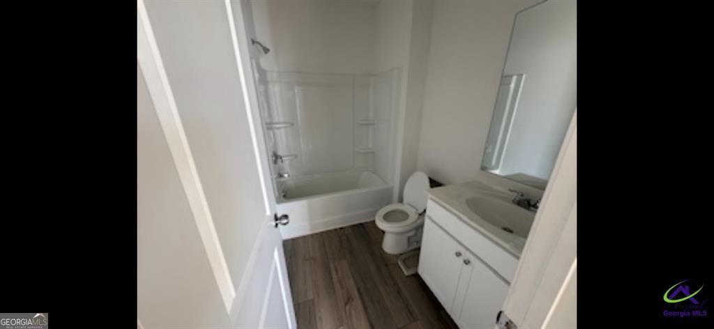 1100 Holland Drive Hampton, GA 30228 - Photo 5 of 15 a bathroom with a granite countertop sink toilet and shower