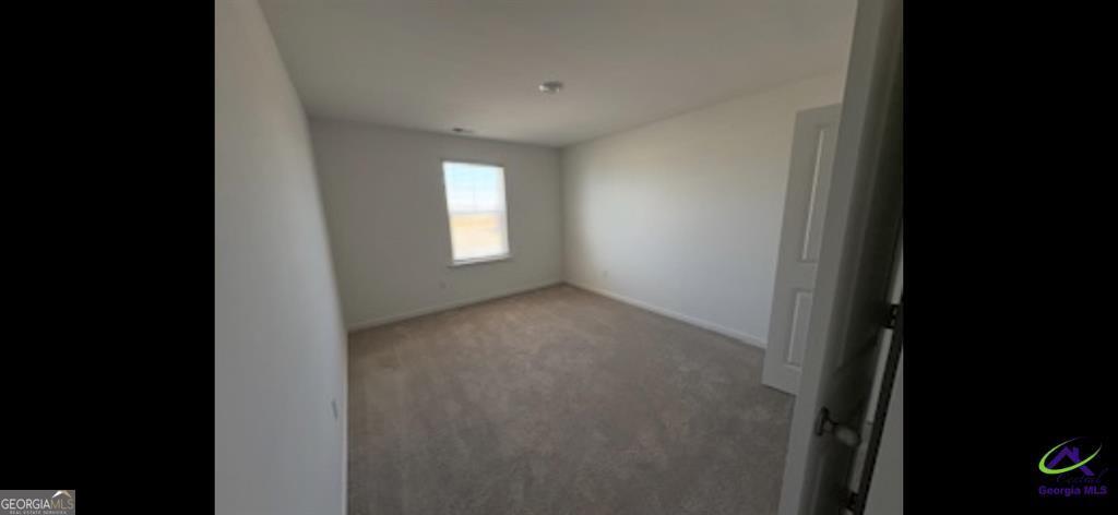 1100 Holland Drive Hampton, GA 30228 - Photo 8 of 15 a view of empty room with window