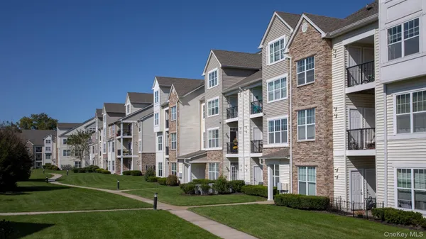 a view of a building with a yard
