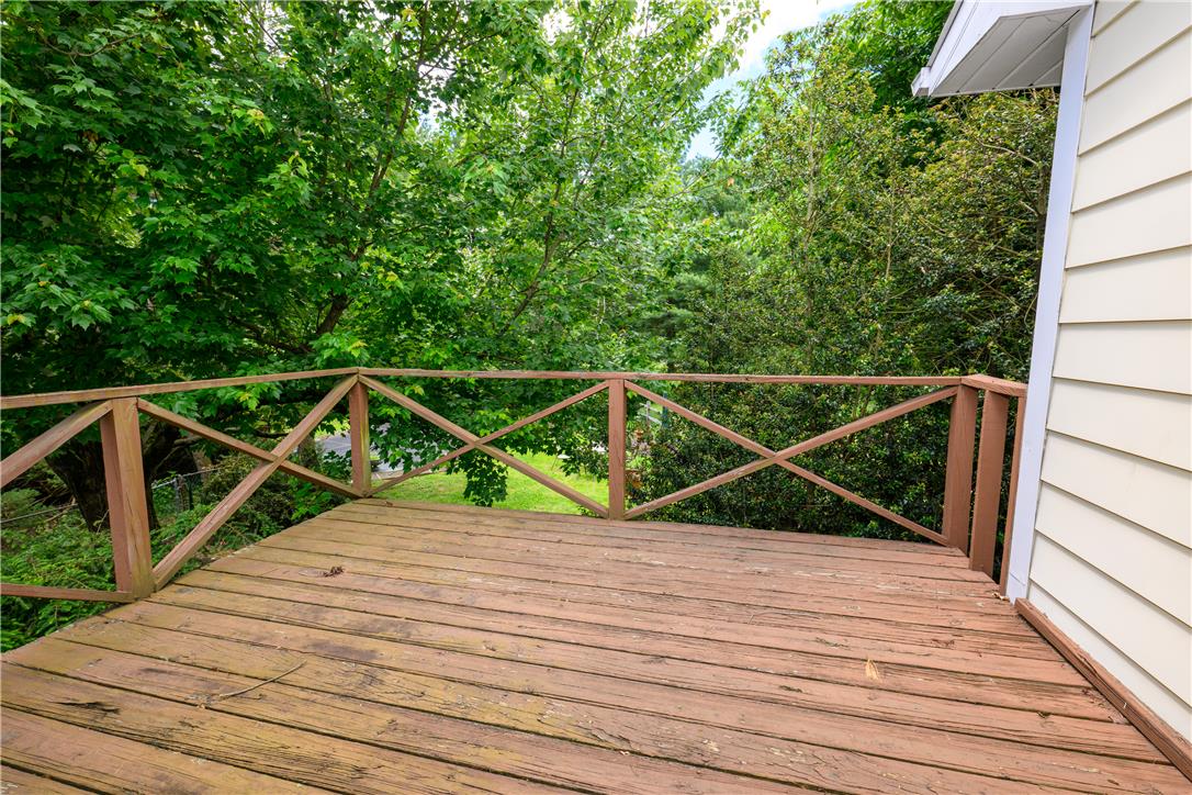 2516 Rachael Lane Orefield, PA 18069 - Photo 32 of 45 A spacious wooden deck provides a tranquil overlook into a lush, green natural landscape.