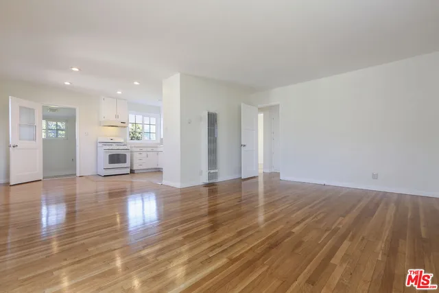 a view of a kitchen with a sink and a stove top oven