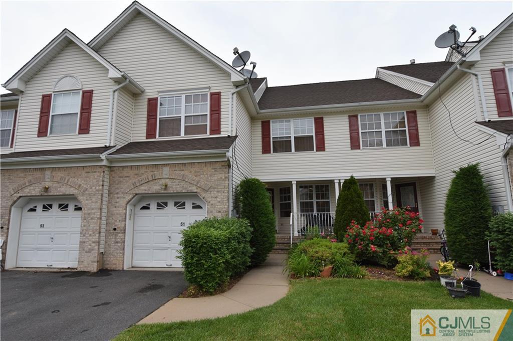 51 Hawthorne Road North Brunswick, NJ 08902 - Photo 1 of 23 a front view of a house with a garden and plants