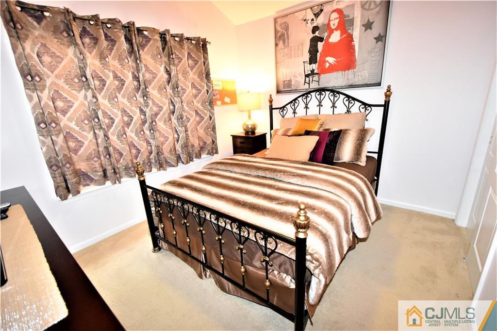 51 Hawthorne Road North Brunswick, NJ 08902 - Photo 16 of 23 a bedroom with two beds and a painting on the wall
