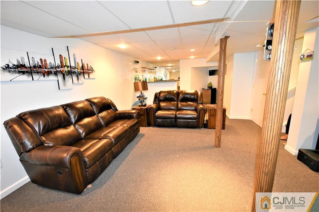 51 Hawthorne Road North Brunswick, NJ 08902 - Photo 18 of 23 a living room with furniture and a wooden floor