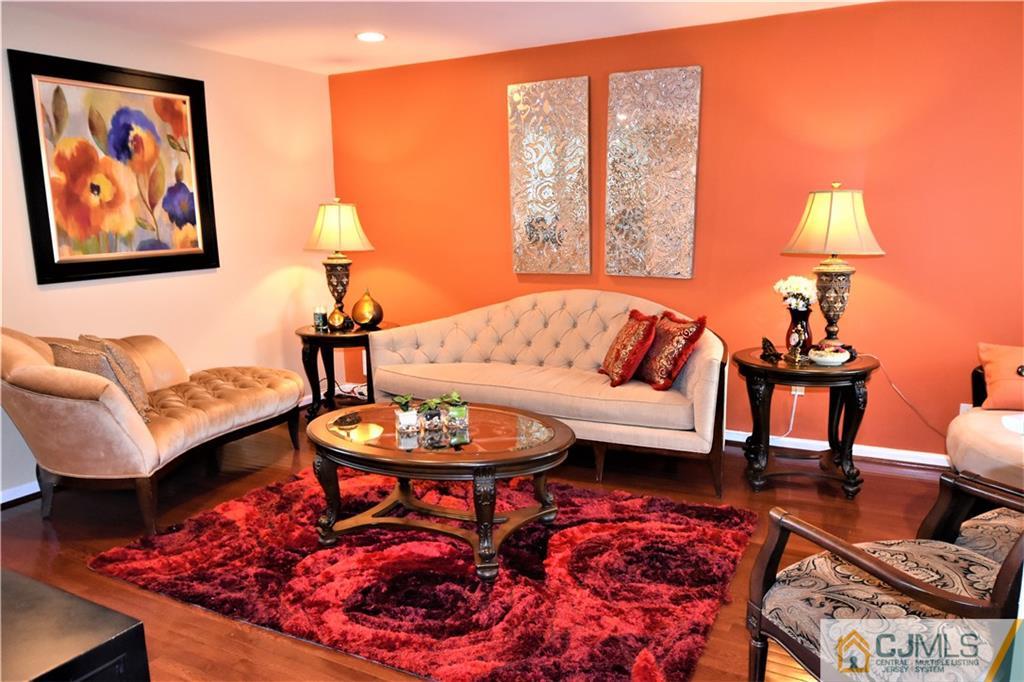51 Hawthorne Road North Brunswick, NJ 08902 - Photo 3 of 23 a living room with furniture a rug and a lamp