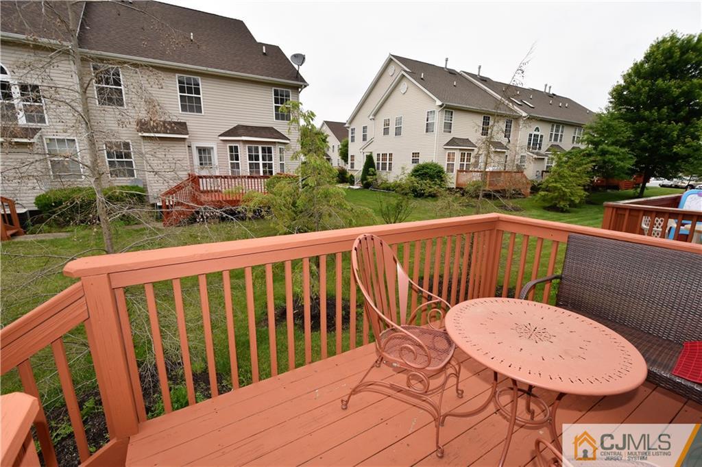 51 Hawthorne Road North Brunswick, NJ 08902 - Photo 21 of 23 a view of a chair and tables in the patio