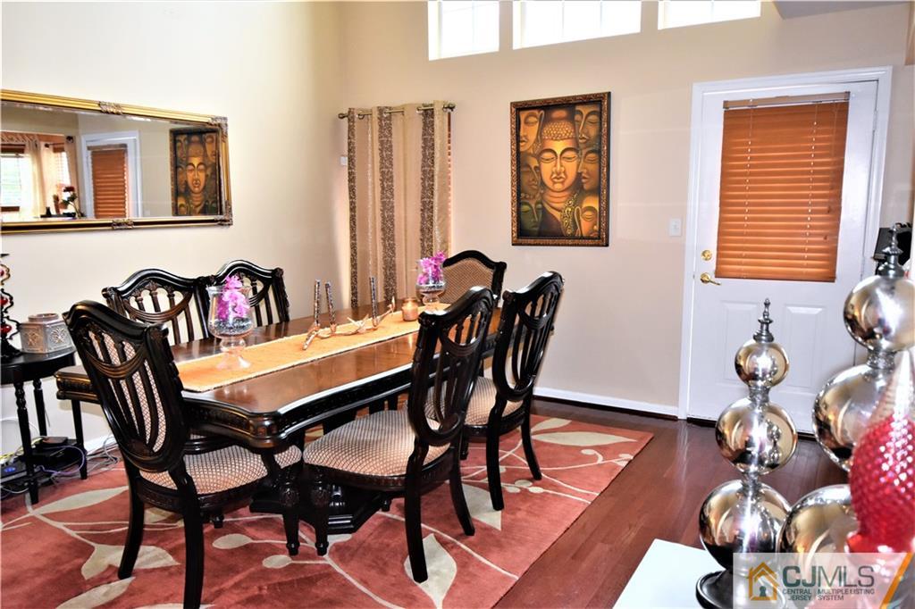 51 Hawthorne Road North Brunswick, NJ 08902 - Photo 6 of 23 a view of a dining room with furniture and wooden floor
