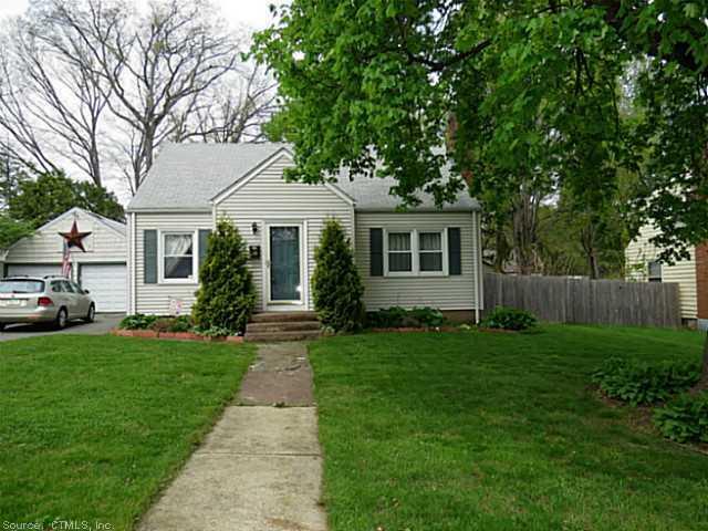 108 Lockwood Street Manchester, CT 06042 - Photo 1 of 1 a front view of a house with a garden