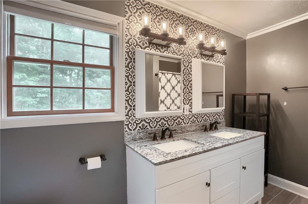 319 Dobson Road Mars, PA 16046 - Photo 17 of 25 a bathroom with a granite countertop sink and a mirror