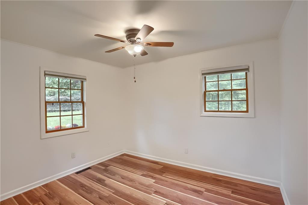 319 Dobson Road Mars, PA 16046 - Photo 19 of 25 an empty room with windows and fan