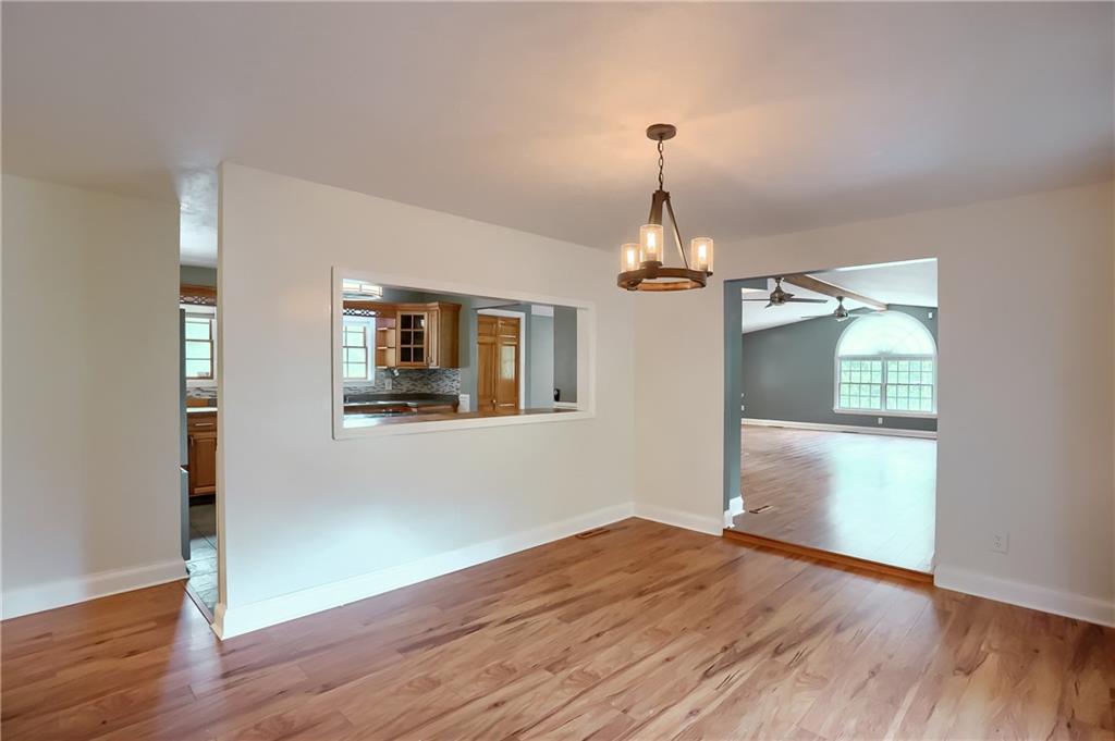 319 Dobson Road Mars, PA 16046 - Photo 4 of 25 a view of a room with wooden floor chandeliers and kitchen