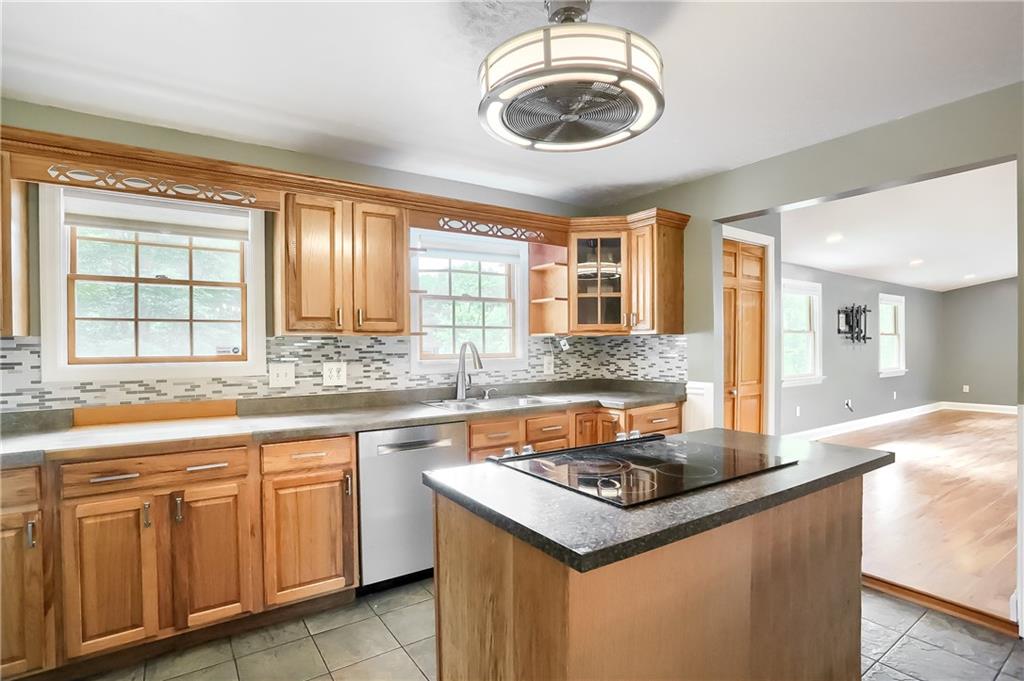 319 Dobson Road Mars, PA 16046 - Photo 6 of 25 a kitchen with a stove cabinets and window