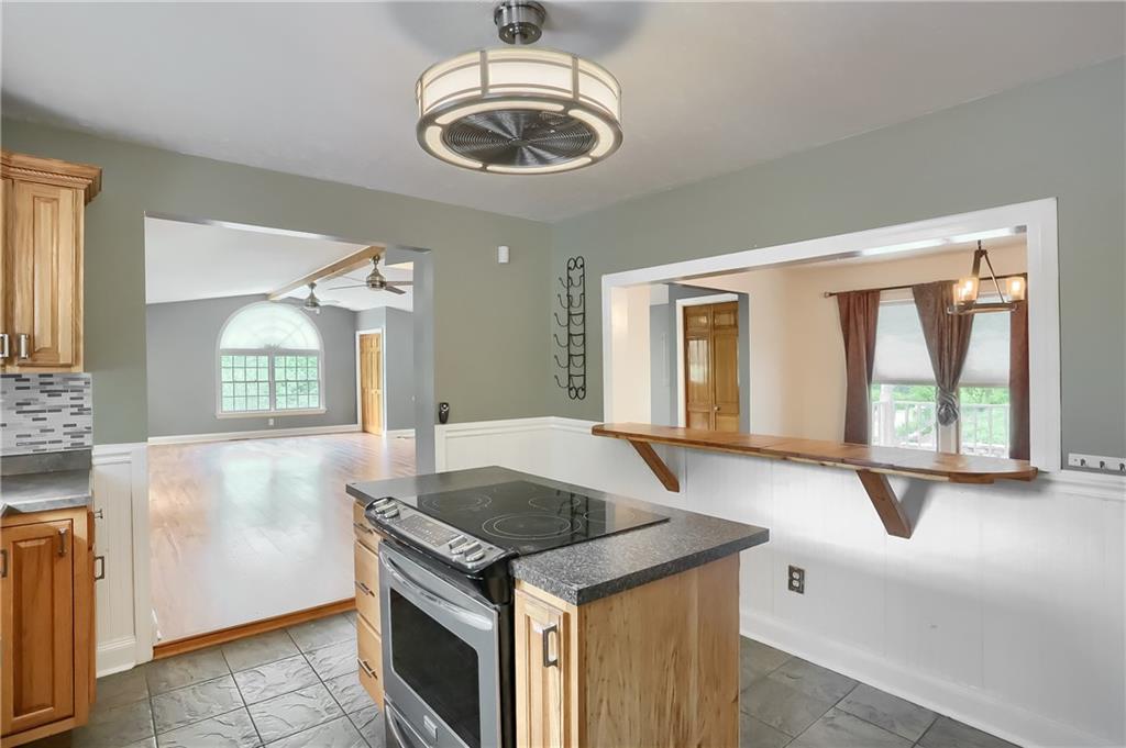 319 Dobson Road Mars, PA 16046 - Photo 7 of 25 a kitchen with stainless steel appliances granite countertop a stove and a sink