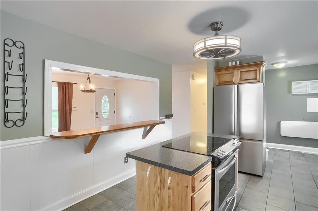 319 Dobson Road Mars, PA 16046 - Photo 8 of 25 a room with furniture and a chandelier