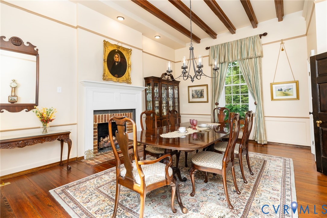 Wood-finish flooring, exposed ceiling beams, and a