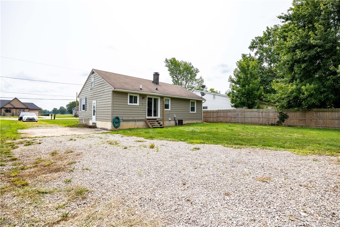 8764 Oberlin Road Elyria, OH 44035 - Photo 8 of 18 Rear view of house featuring a lawn