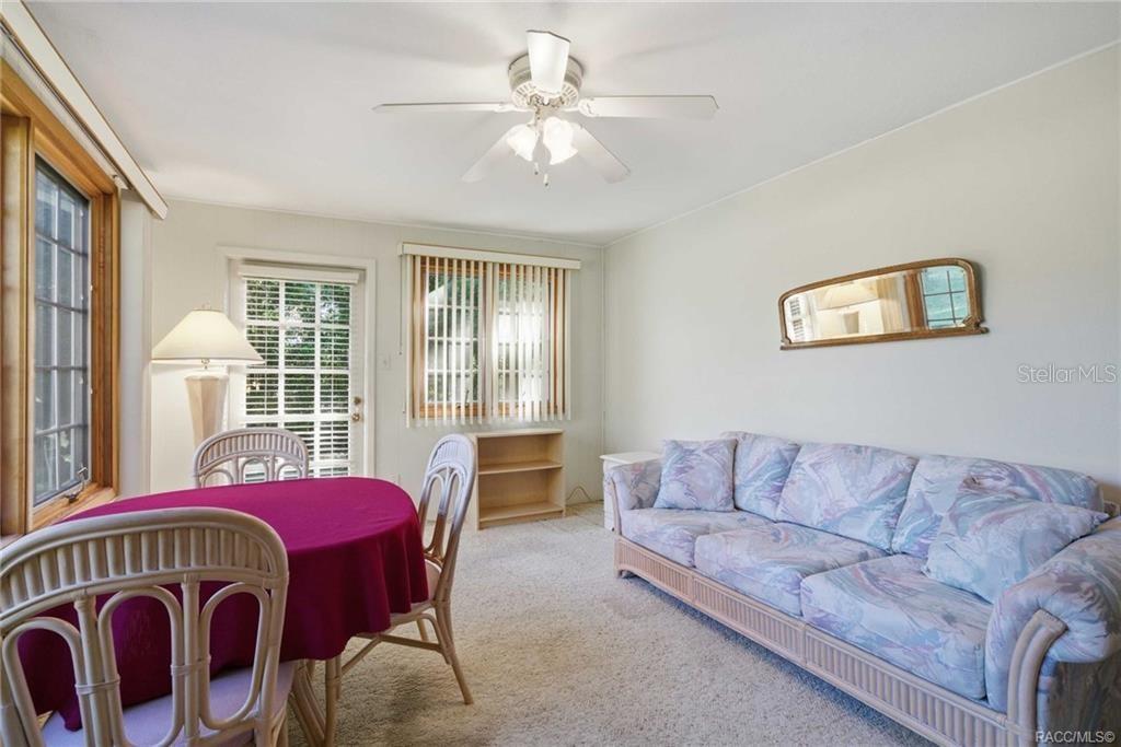 8709 East Sandpiper Drive Inverness, FL 34450 - Photo 14 of 37 a living room with furniture and windows