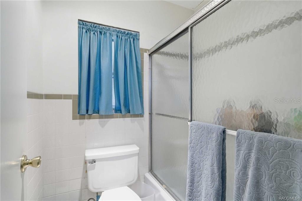 8709 East Sandpiper Drive Inverness, FL 34450 - Photo 17 of 37 a bathroom with a toilet and a shower