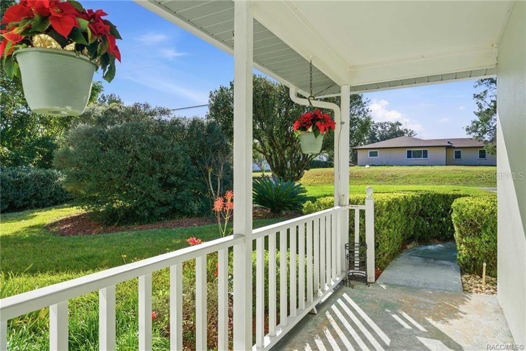 8709 East Sandpiper Drive Inverness, FL 34450 - Photo 2 of 37 a view of a chair and table in the balcony