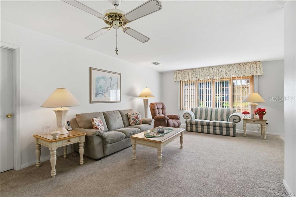 8709 East Sandpiper Drive Inverness, FL 34450 - Photo 3 of 37 a living room with furniture and a window