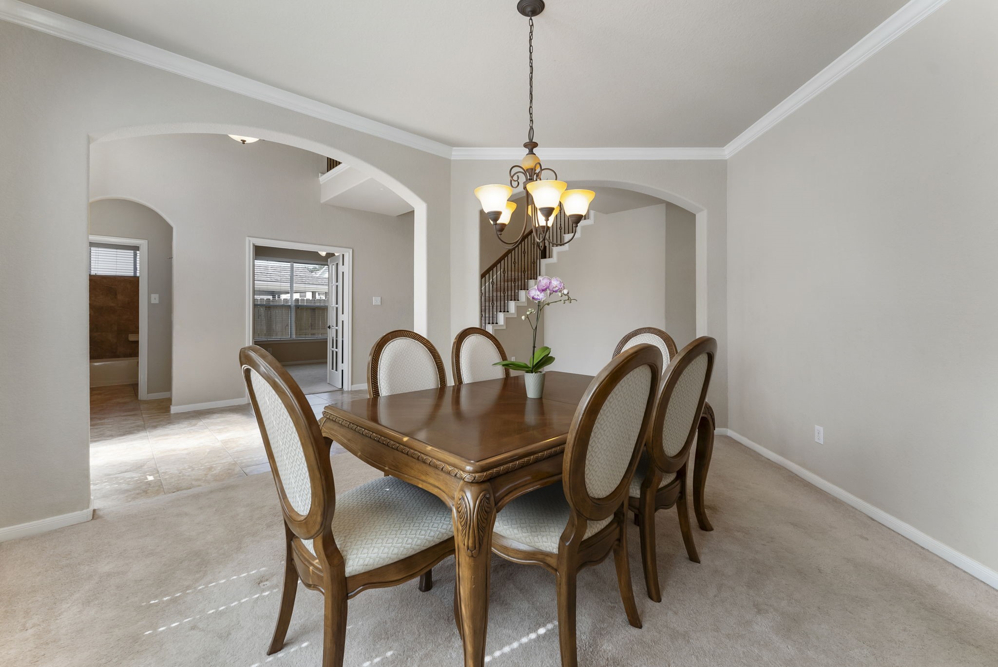 19223 Senterra Lakes Boulevard Spring, TX 77379 - Photo 14 of 48 a view of a dining room with furniture and chandelier
