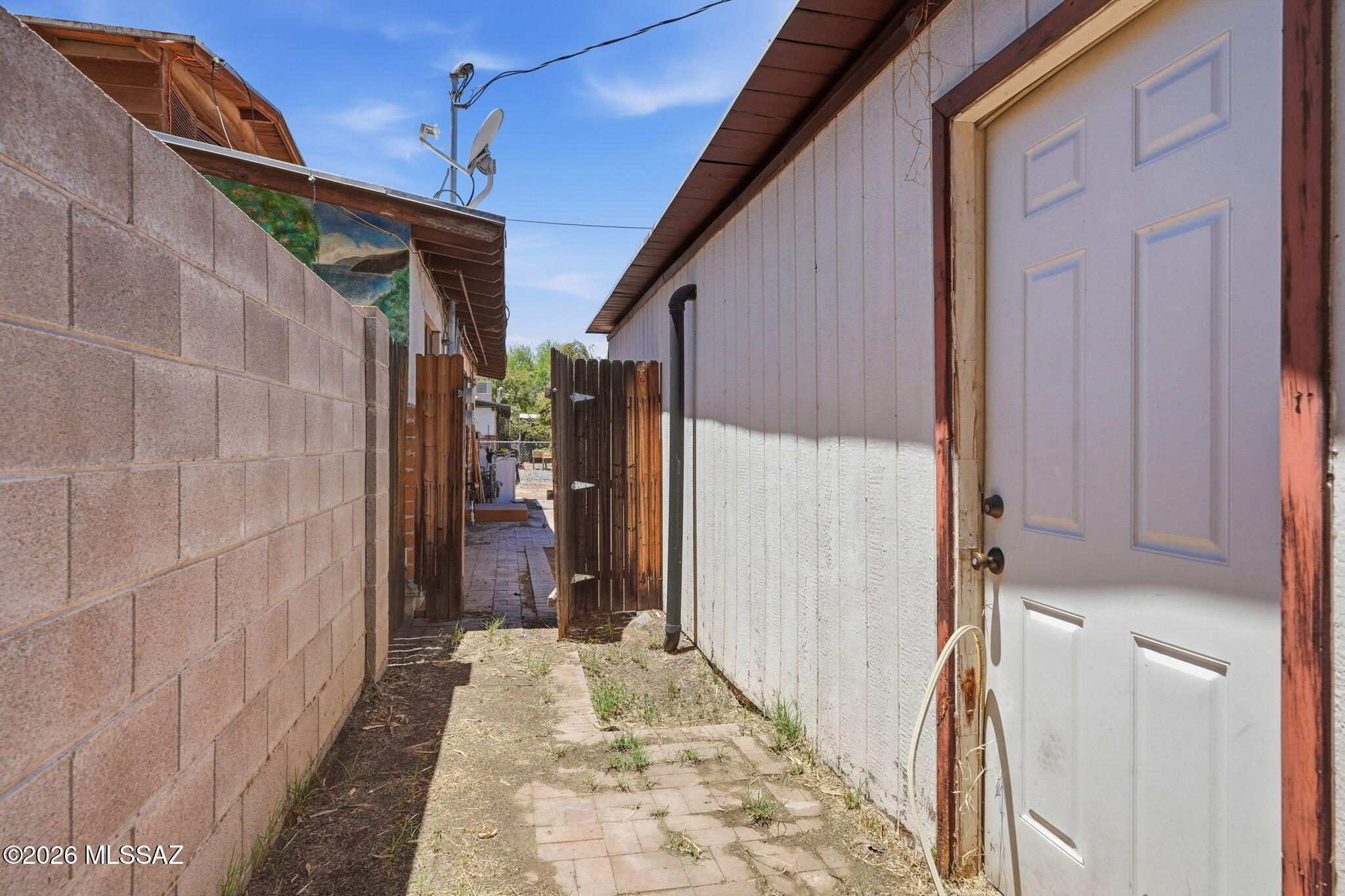 2721 East Fort Lowell Road Tucson, AZ 85716 - Photo 27 of 28 a view of a house with a wooden door